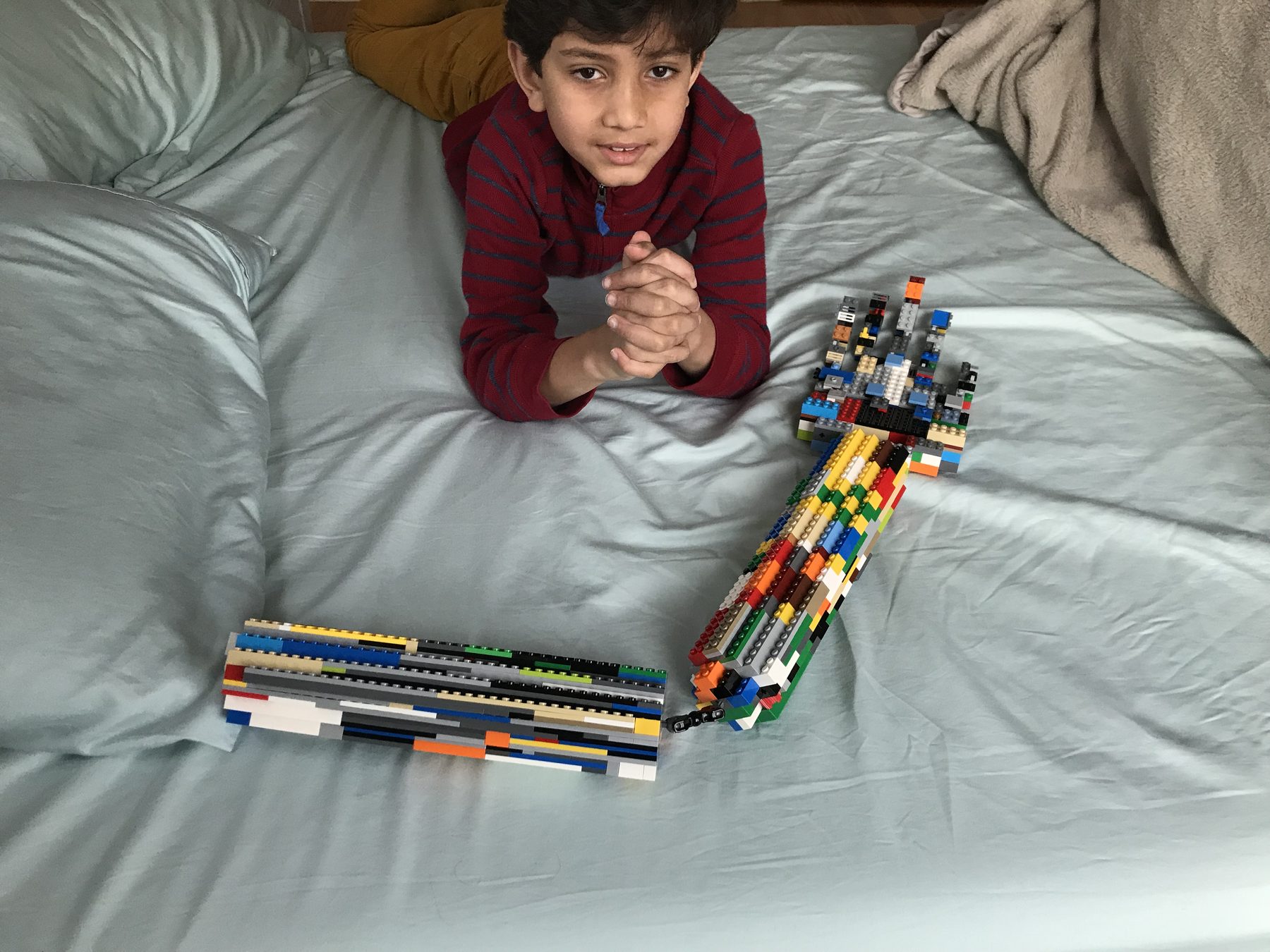 Me as a kid holding a life-scale LEGO hand I built